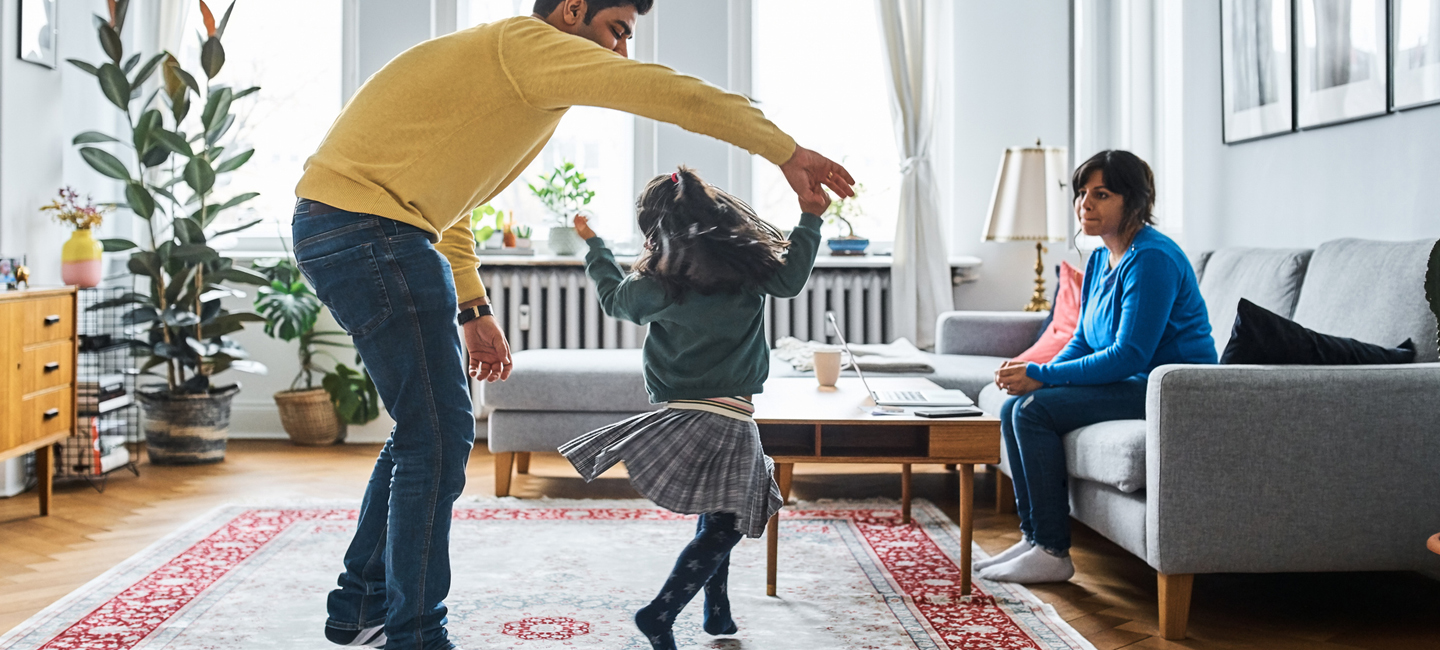 A family playing together in their living room in Lake Oswego, Oregon